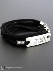 The "POWERED BY LOVE" Hand Stamped Omnisex Silver And Eco Leather Wrap Bracelet