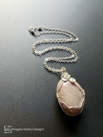 Intricately Wire-Wrapped Beach Stone on Silver