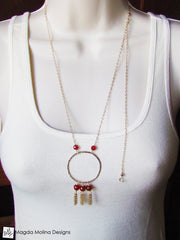 The Long Hammered Gold Ring Necklace With Carnelian And Tassels