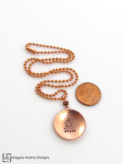 The Hand Stamped Copper Buddha And Peace Necklace