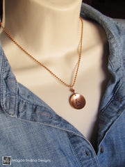 The Hand Stamped Copper Buddha And Peace Necklace
