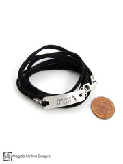 The "POWERED BY LOVE" Hand Stamped Omnisex Silver And Eco Leather Wrap Bracelet