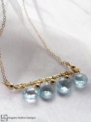 The Something Blue Necklace: Horizontal Hammered Gold And Blue Topaz Drops