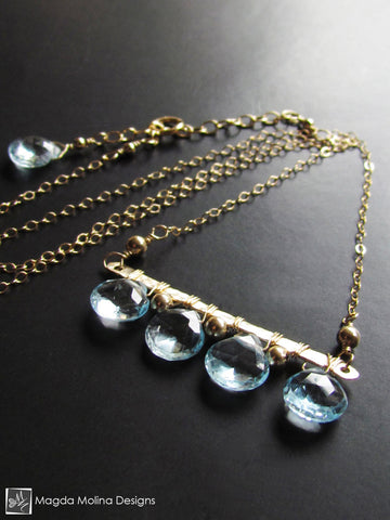 The Something Blue Necklace: Horizontal Hammered Gold And Blue Topaz Drops