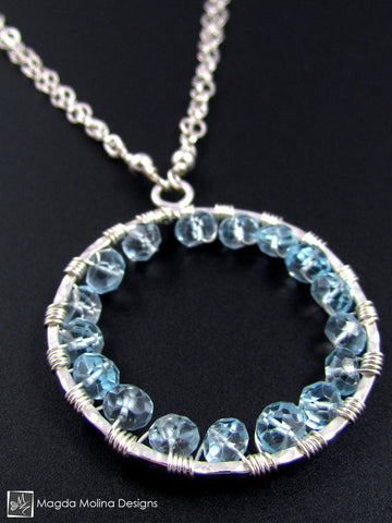 The Infinity Circle Hammered Silver Necklace With Blue Topaz Gemstones