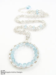 The Infinity Circle Hammered Silver Necklace With Blue Topaz Gemstones